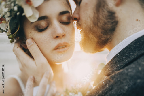 Caucasian bride and groom on sunny day photo