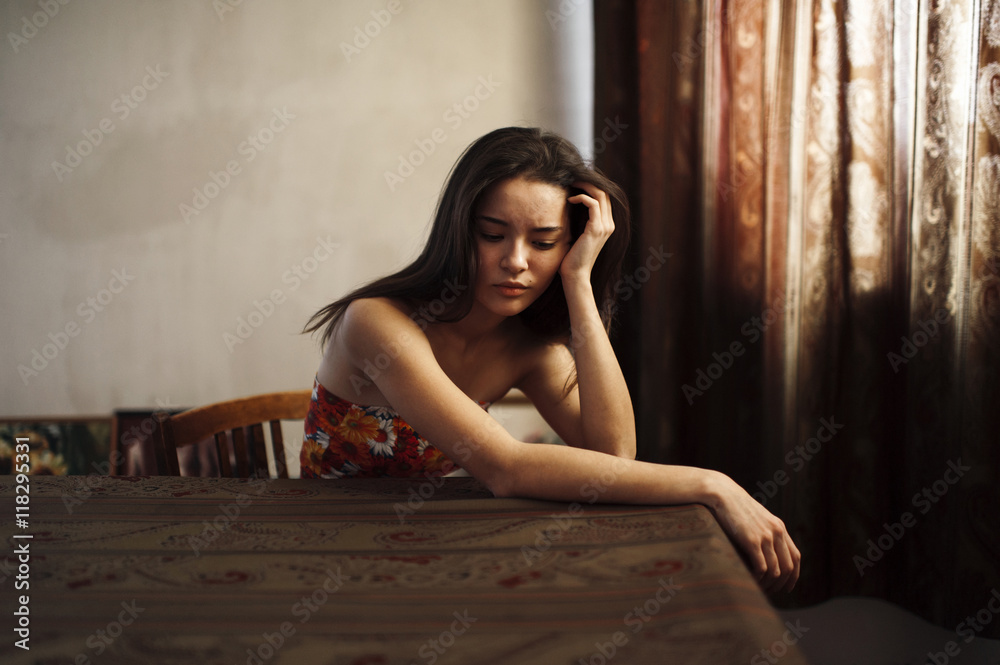 Caucasian woman sitting at table Caucasian woman sitting at table