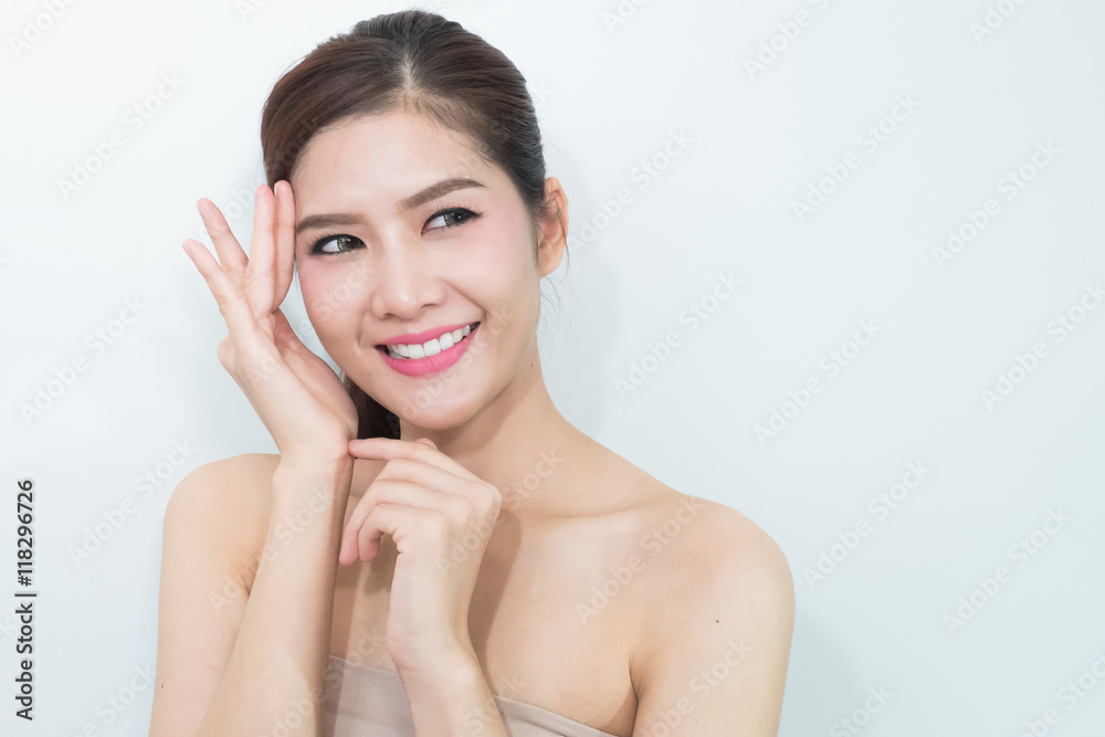 The Portrait of a beautiful female model on white background The Portrait of a beautiful female model on white background