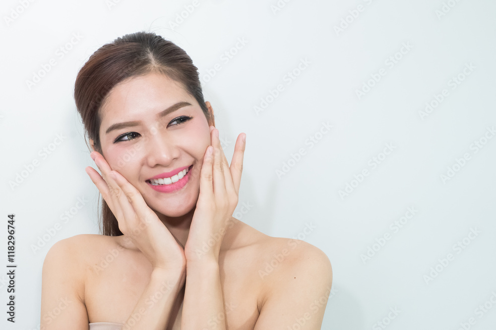 The Portrait of a beautiful female model on white background The Portrait of a beautiful female model on white background