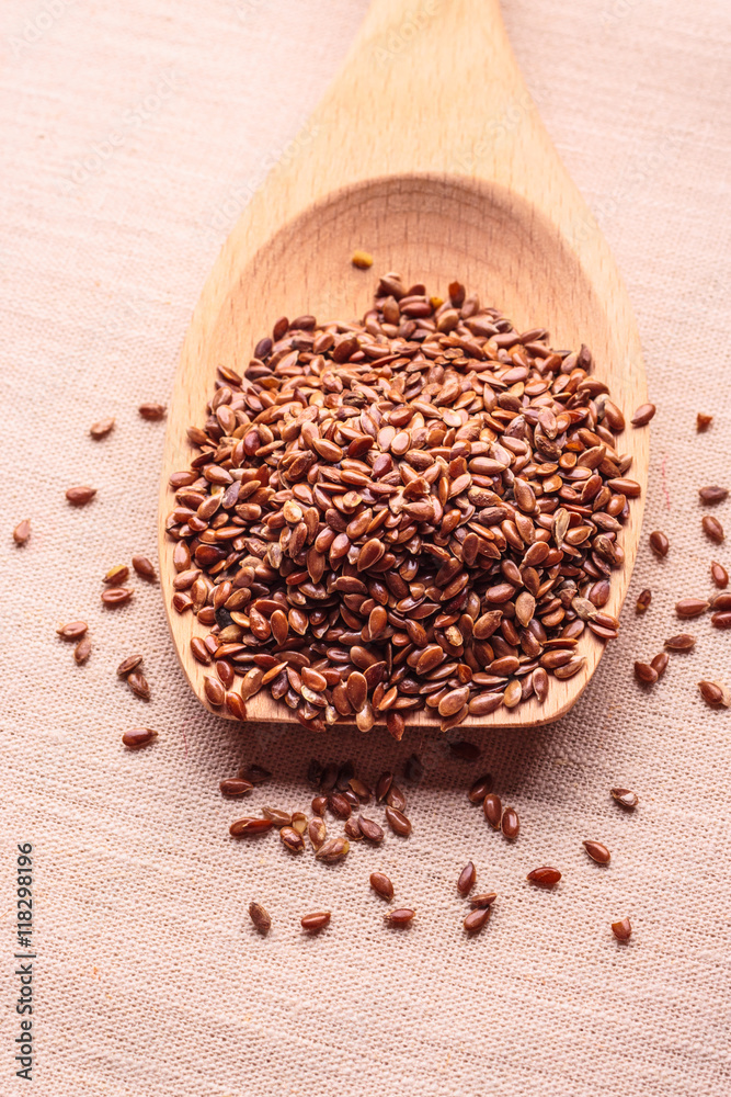 Flax seeds linseed on wooden spoon Flax seeds linseed on wooden spoon