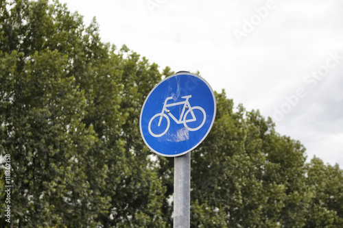 Bicycle traffic sign in BerlinBicycle traffic sign with background of trees in Berlin