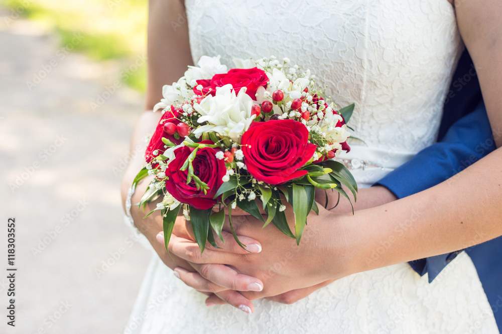 Photo of happy just married wedding couple holding a bouquet Photo of happy just married wedding couple holding a bouquet