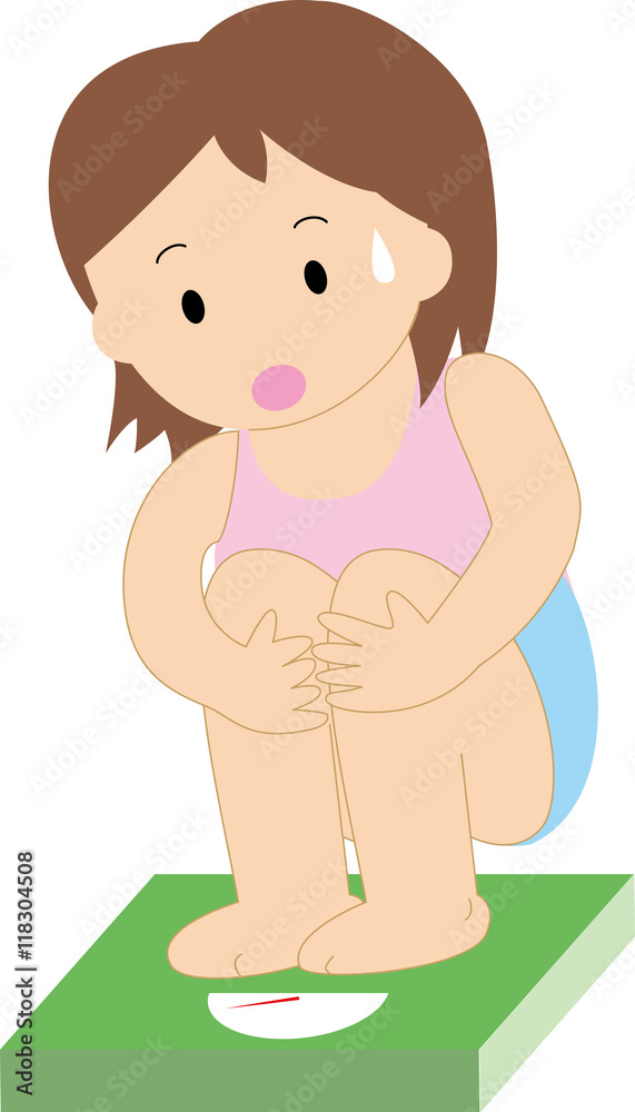 体重計に乗る女性 体重計に乗る女性