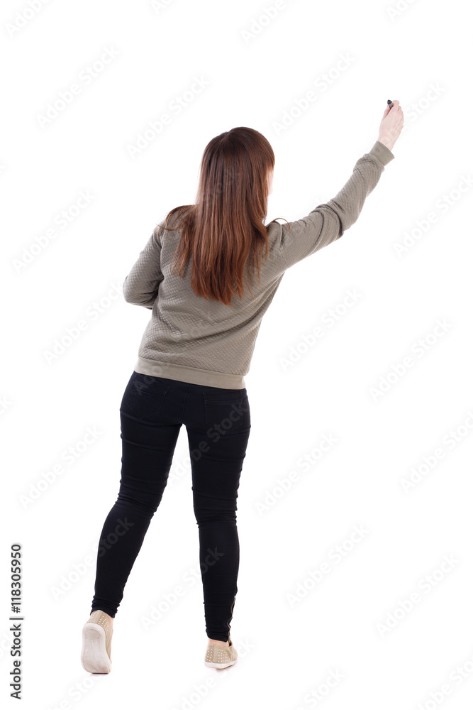 back view of writing beautiful woman. Rear view people collection. backside view of person. Isolated over white background. A young girl in a gray sweater pulled up with a felt-tip pen in a hand. back view of writing beautiful woman. Rear view people collection. backside view of person. Isolated over white background. A young girl in a gray sweater pulled up with a felt-tip pen in a hand.