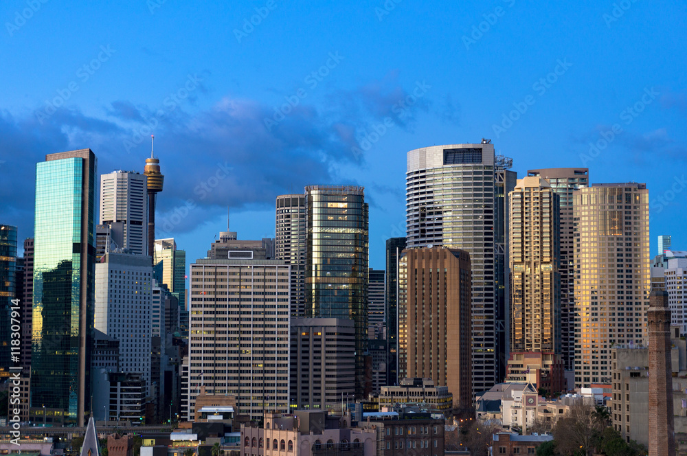 Aerial view of Sydney Central Business District skyscrapers against blue sky on the background. Urban landscape view from above. NSW, Australia
