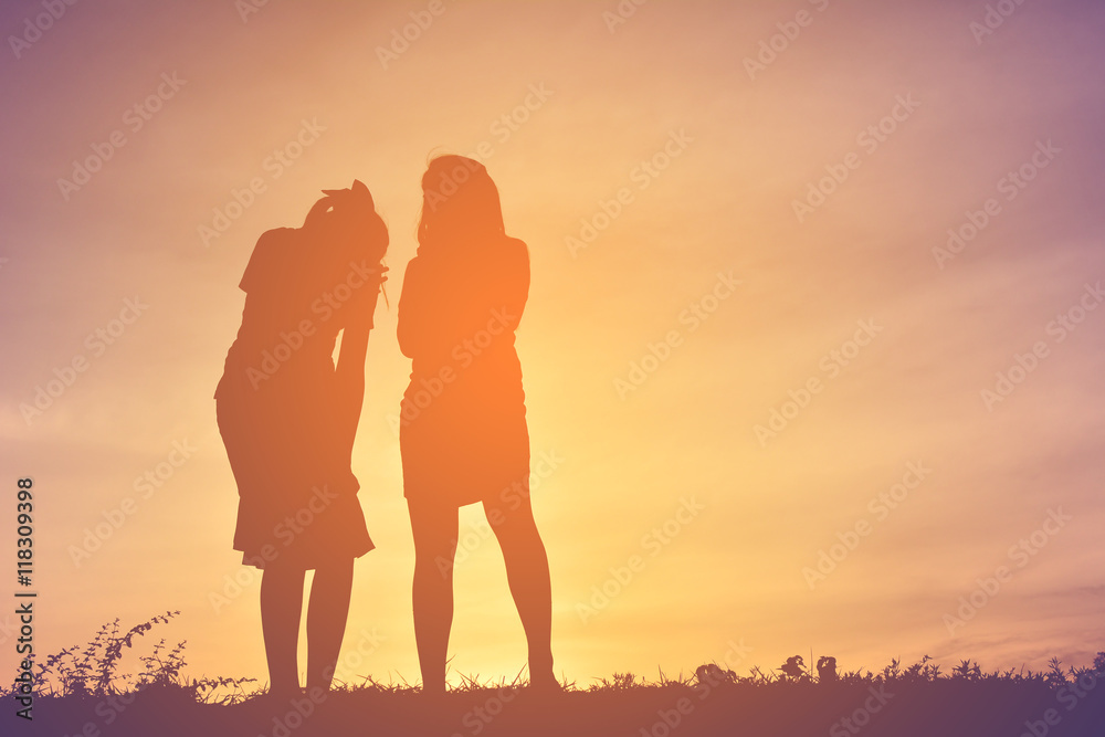 Silhouette sad women on sunset