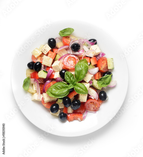 greek salad in plate isolated on white background