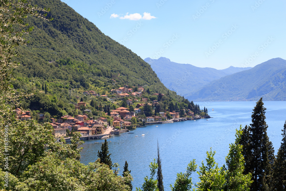 Panorama of lakeside village Fiumelatte at Lake Como with mountains in Lombardy, Italy
