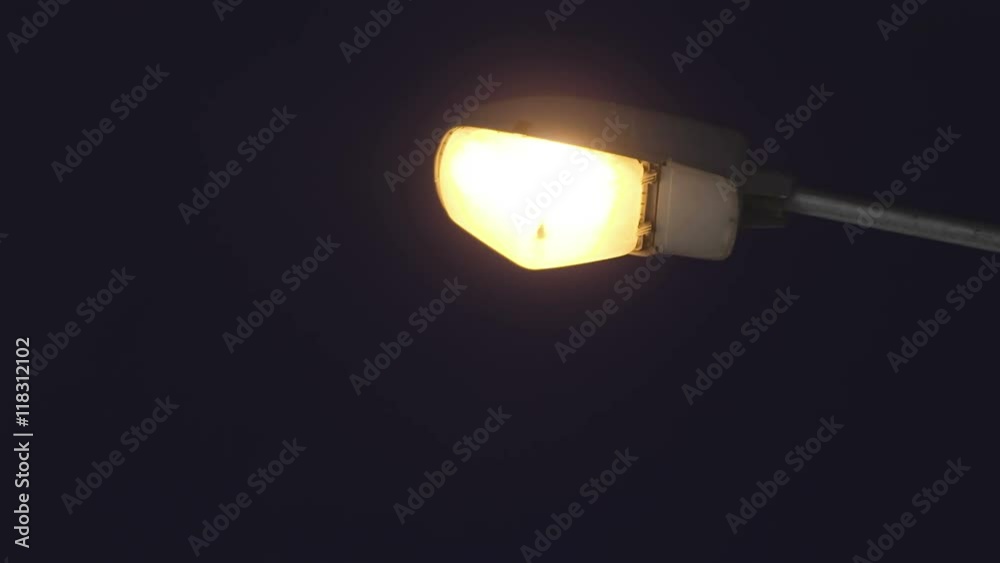4K Old city street lamp turns on after earthquake