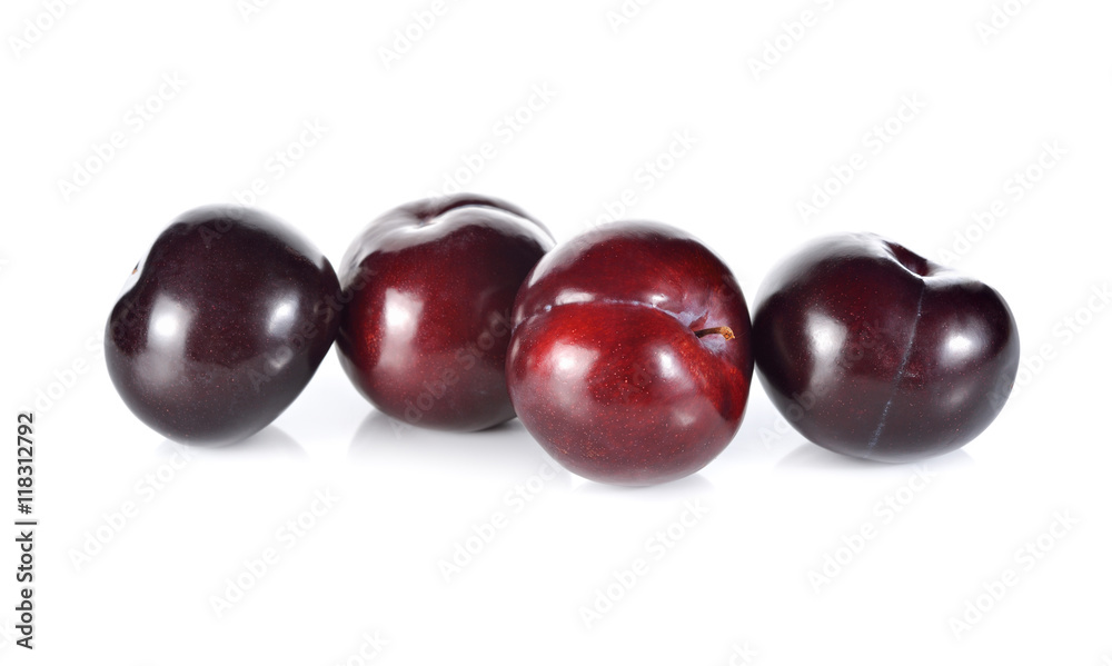 whole ripe plum on white background whole ripe plum on white background