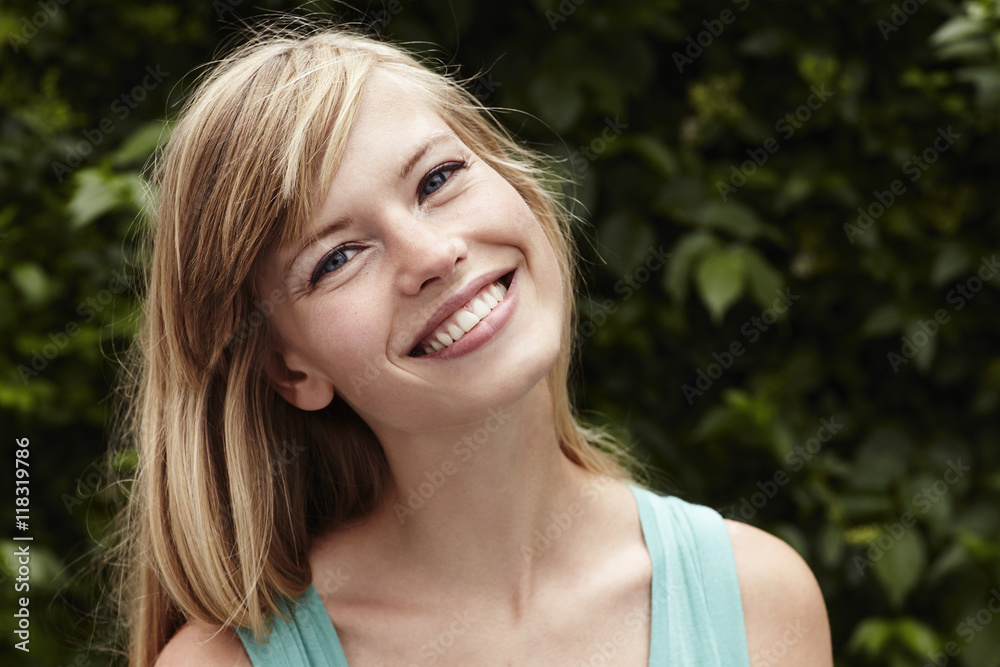 Blue eyes and beautiful smile on young woman