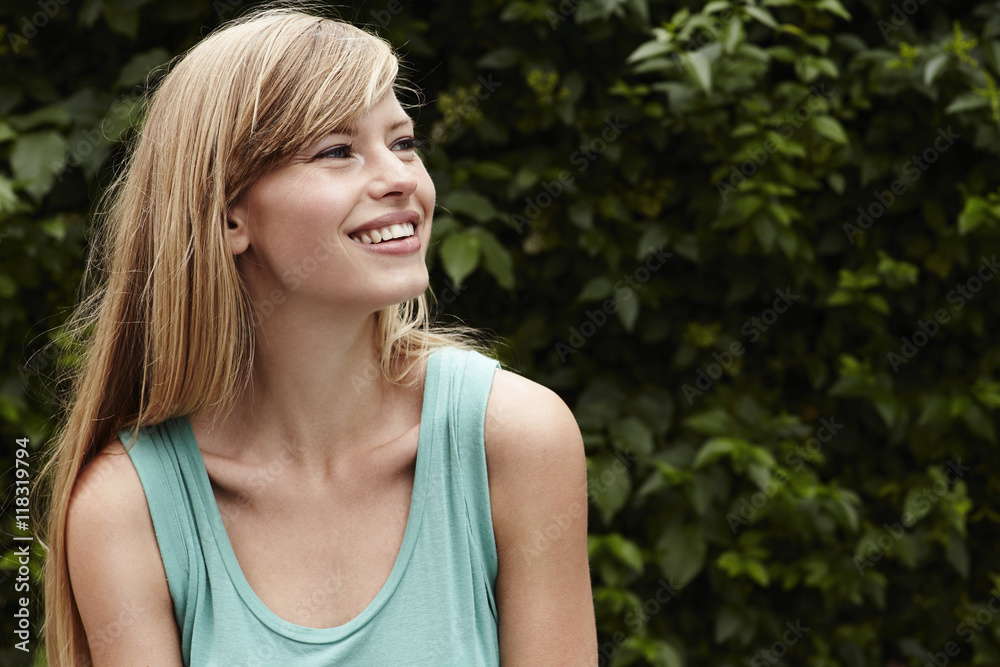 Smiling and gorgeous young blond woman, looking away Smiling and gorgeous young blond woman, looking away