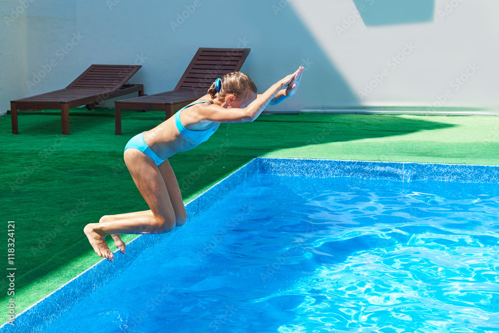 Girl jumping into pool