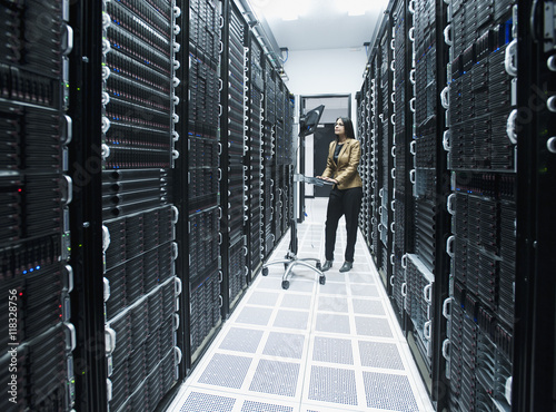 Business people working in server room photo