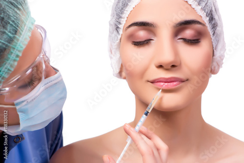 Young woman preparing for plastic surgery isolated on white