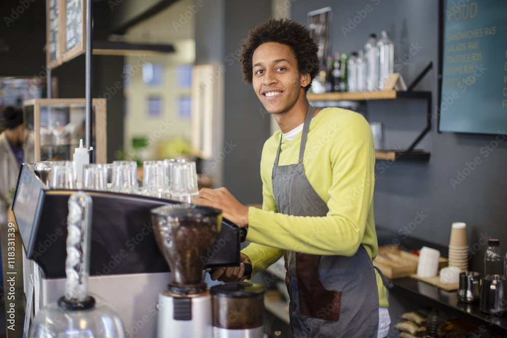 Mixed race barista working in coffee shop Mixed race barista working in coffee shop