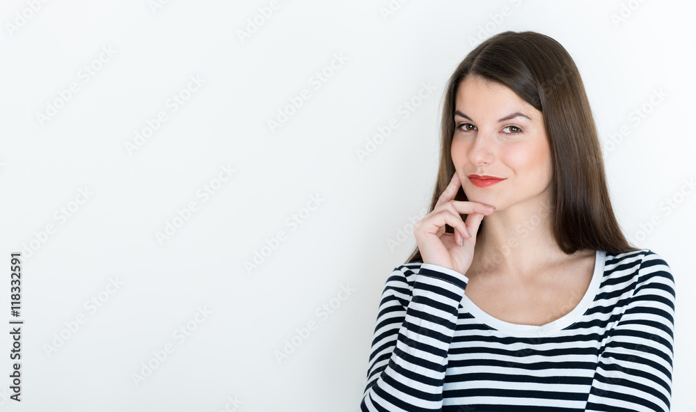 Attractive young woman deep in her thoughts, on white background Attractive young woman deep in her thoughts, on white background