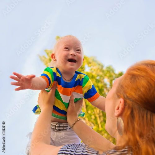 Baby with Down syndrome is happy
