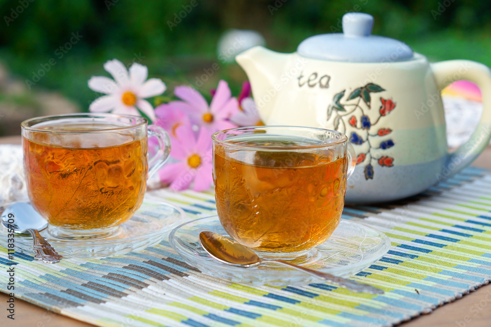 Two cups of tea on table in garden