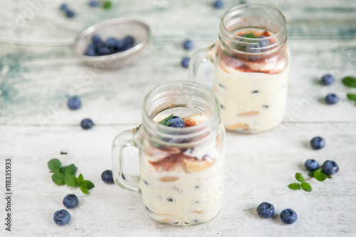 Tiramisu in glass jars with fresh blueberries
