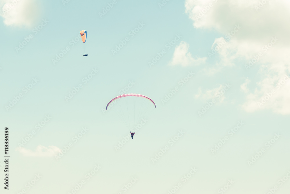 Two paraglider in the sky in sun light Two paraglider in the sky in sun light