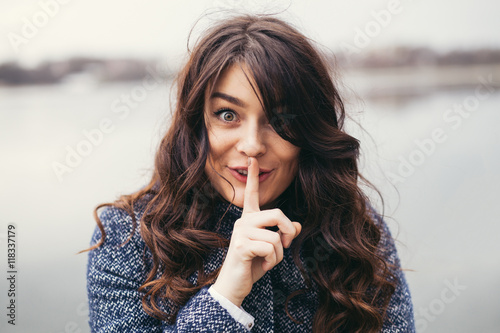Beautiful woman keeping a secret