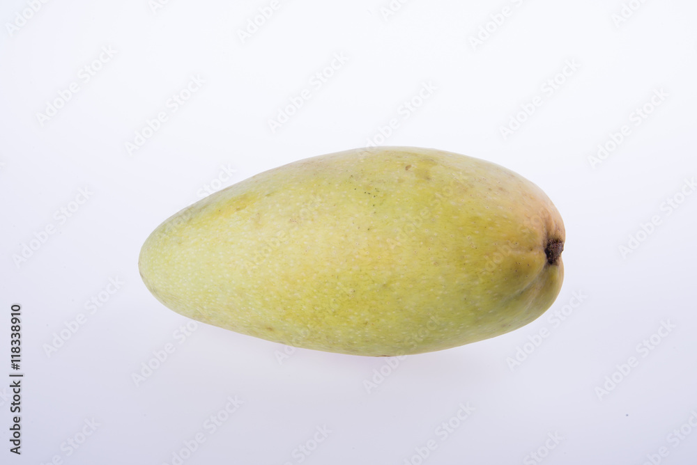 mangos or green yellow mangos on background. mangos or green yellow mangos on background.
