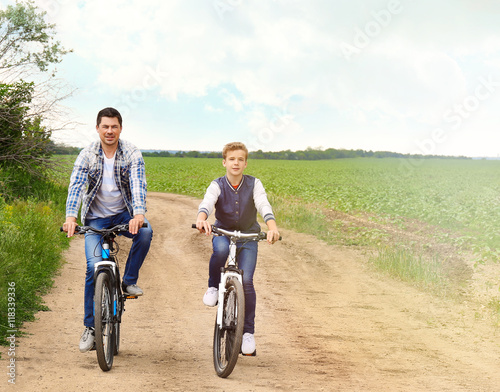 Father with son riding bike...