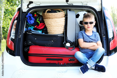 Cute little boy sitting in ...