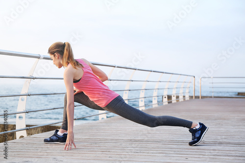 Young woman doing exercises...