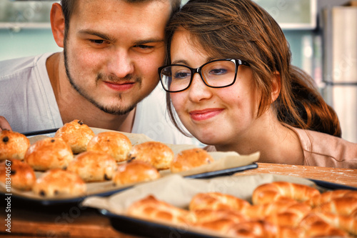 Young Couple Baking Yeast Cake