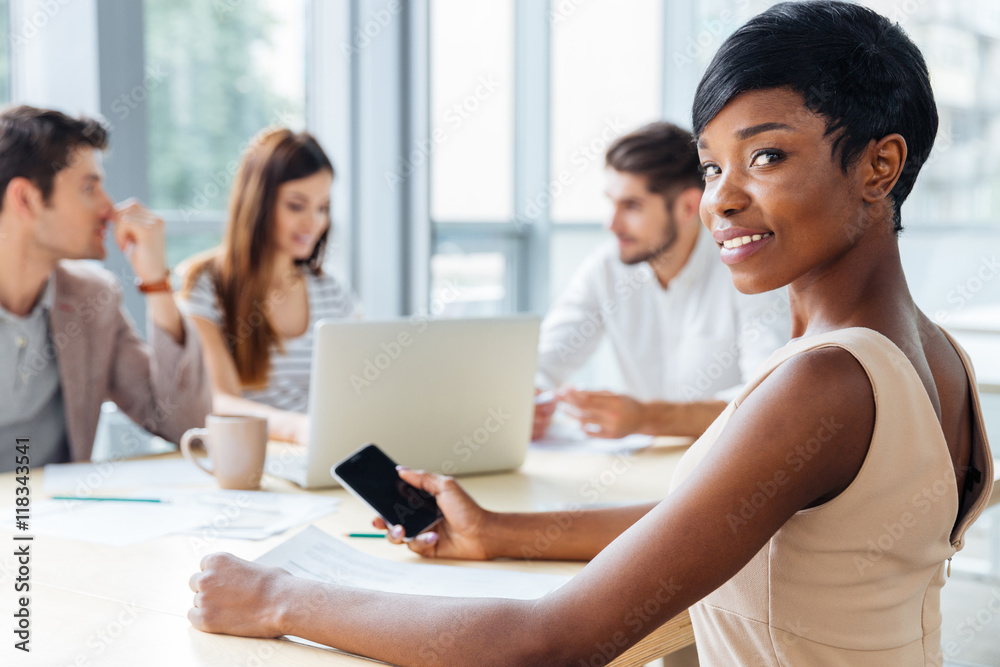 Businesswoman using blank screen smartphone on business meeting Businesswoman using blank screen smartphone on business meeting