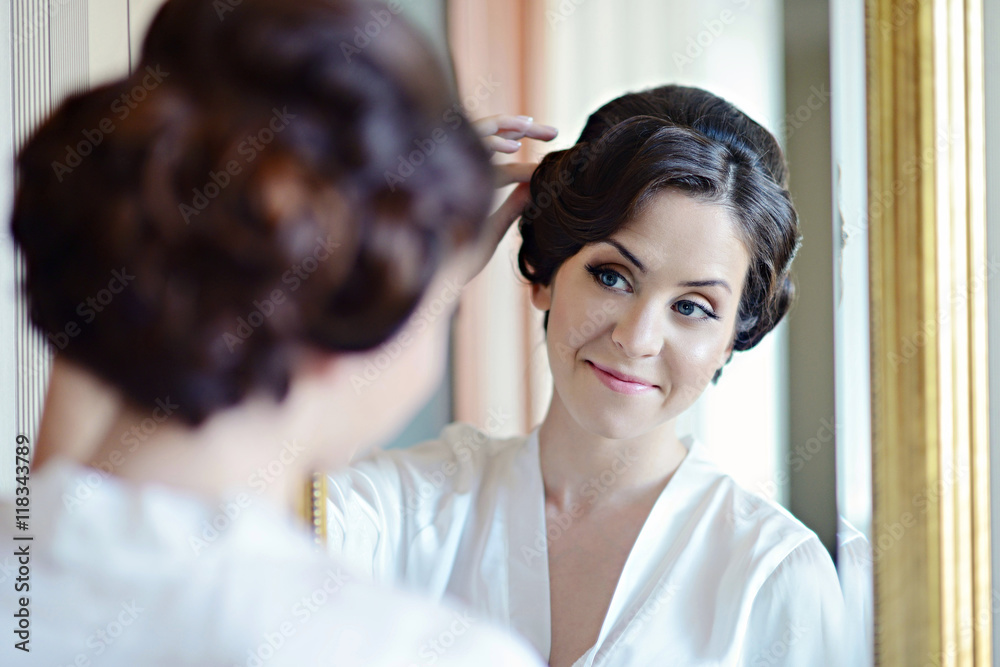 Beauty bride in dressing gown with bridal makeup indoors. Beautiful model girl in colorful wedding robe. Female portrait of cute lady. Woman with hairstyle Beauty bride in dressing gown with bridal makeup indoors. Beautiful model girl in colorful wedding robe. Female portrait of cute lady. Woman with hairstyle