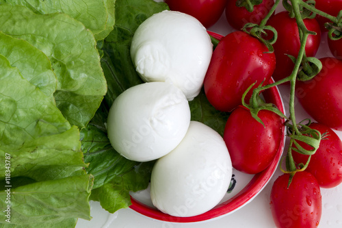 Green salad, white mozzarella and red tomatoes - the color of the Italian flag