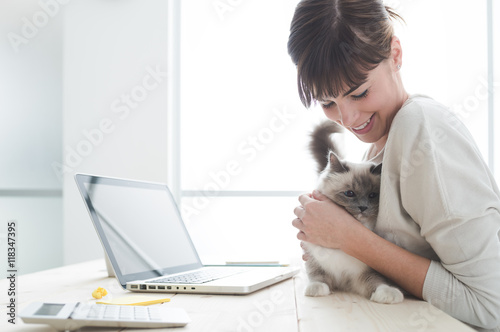 Woman cuddling her cat