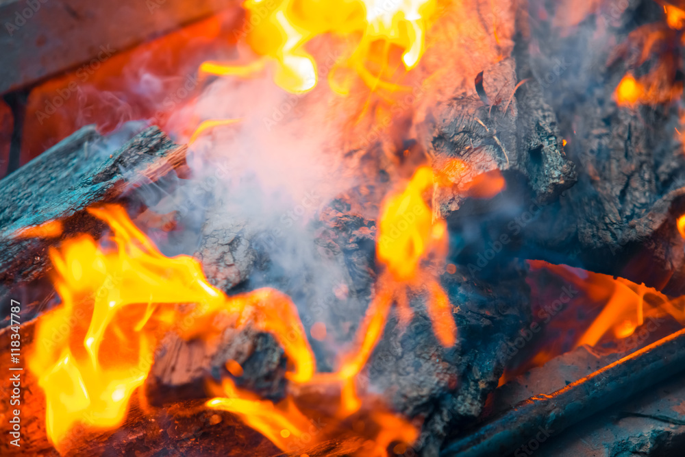 Fototapeta premium Beautiful burning fire flame background with smoke
