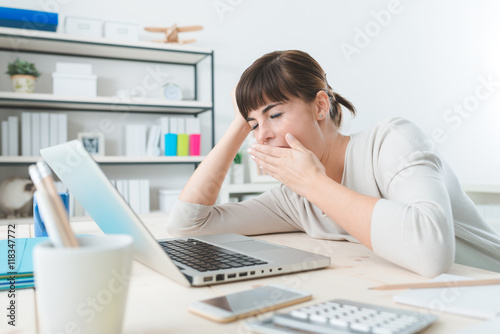 Sleepy woman in the office photo