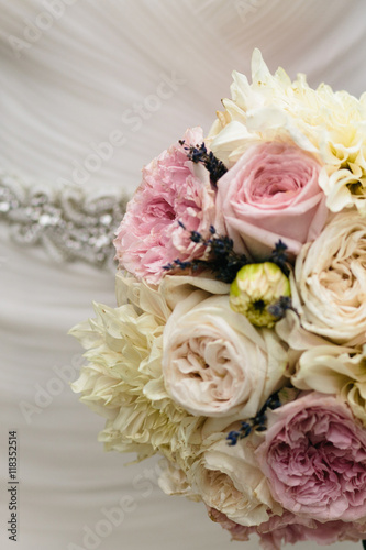 Wedding bouquet made of pink and white pionies and roses