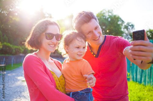 Young and happy family taking a selfie.