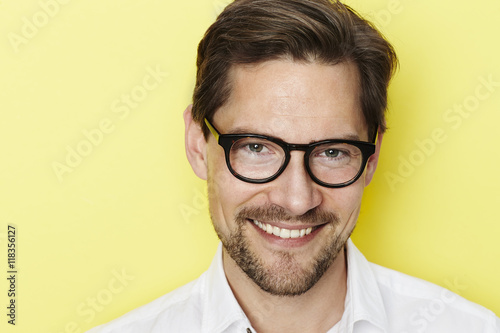 Fototapeta Naklejka Na Ścianę i Meble -  Portrait of man smiling in glasses