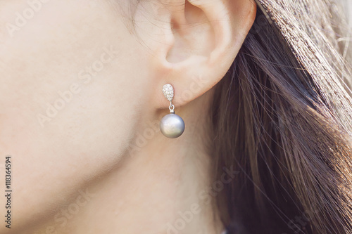 Fotografie, Obraz Woman ear wearing beautiful luxury earring
