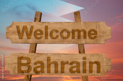 Welcome to  Bahrin sing on wood background with blending national flag photo