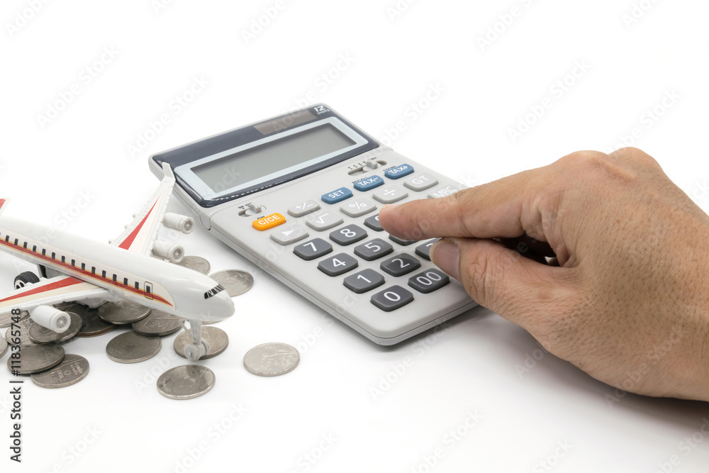 Calculator and toy plane and hand on white background Calculator and toy plane and hand on white background