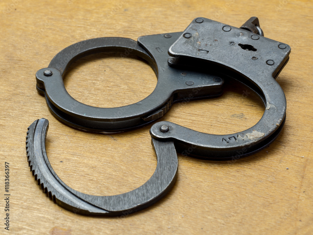 Handcuffs,and money.The concept of crime and punishment.