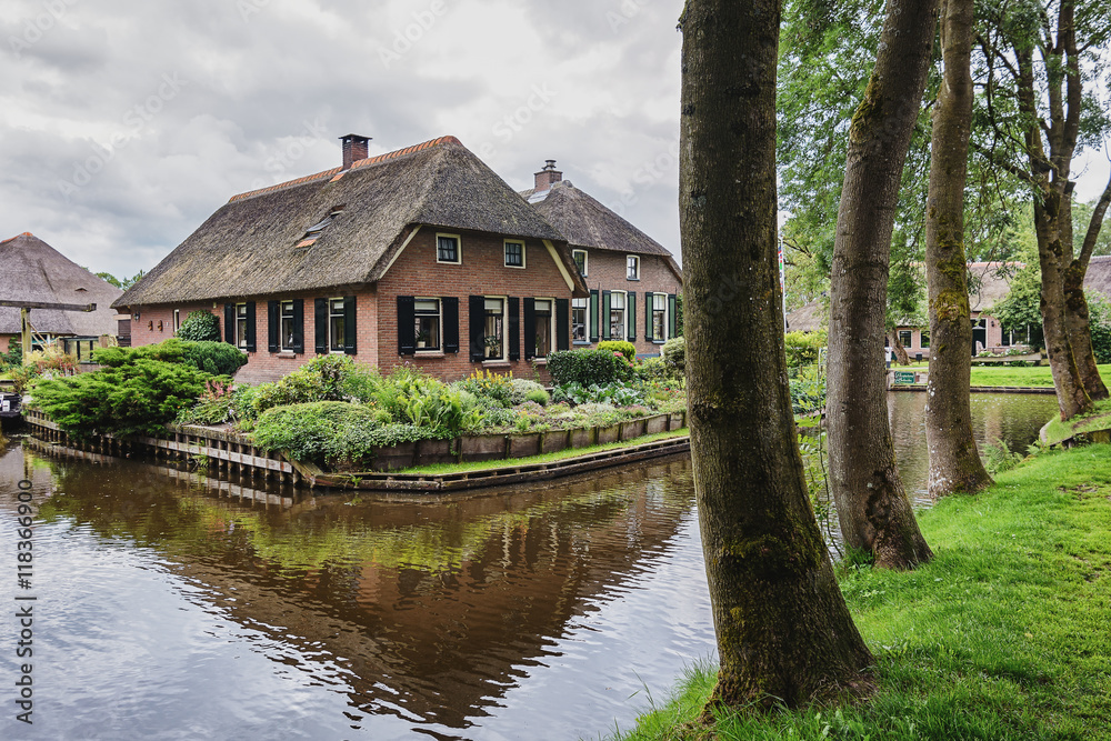 The house stands between the channels in the Dutch village of Giethoorn The house stands between the channels in the Dutch village of Giethoorn