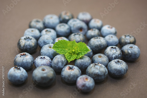 Group of blueberries on a dark background.