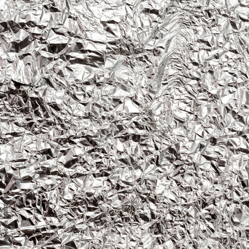 Silver crumpled foil texture background
