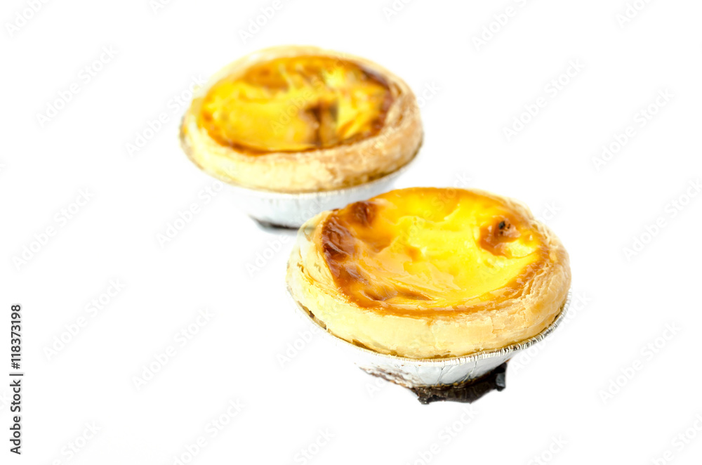 egg tart in foil on white isolated