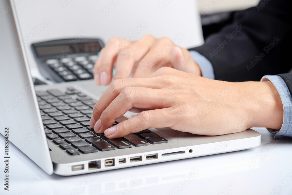 Business man hands typing on a PC or laptop keyboard Business man hands typing on a PC or laptop keyboard